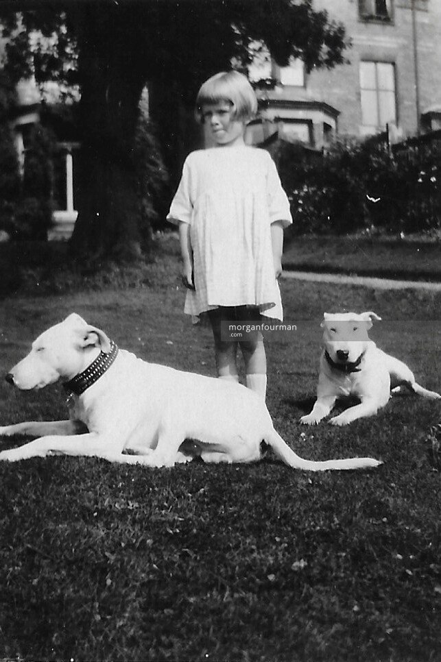 Pamela Downing with dogs in the gardens at 16 Woodbourne Rd, Sep 1924