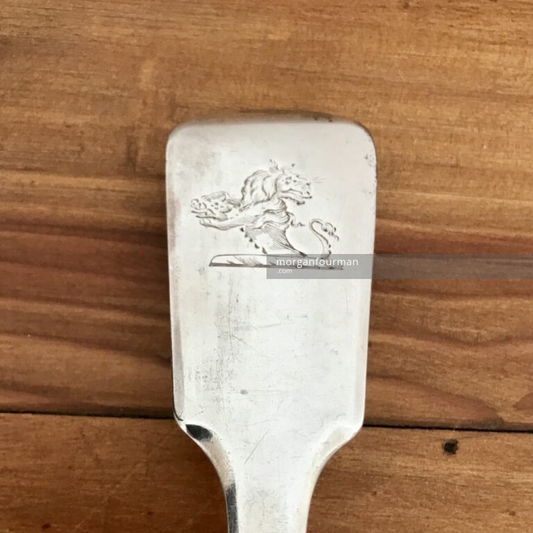 The Lion crest, serving spoon